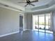 Living room with neutral color walls and ceiling fan at 4510 Big Woods Way, Parrish, FL 34219