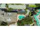 Aerial view of a community pool with sun loungers and nearby parking at 501 Knights Run Ave # 1209, Tampa, FL 33602