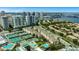 Aerial view of a condo community near tennis courts, a pool, and waterfront views at 501 Knights Run Ave # 1209, Tampa, FL 33602