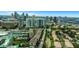 Aerial view of the condominium complex set against the backdrop of a vibrant cityscape at 501 Knights Run Ave # 1209, Tampa, FL 33602