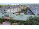 Aerial view of the condominium complex showcasing lush landscaping, green roofs, and community layout at 501 Knights Run Ave # 1209, Tampa, FL 33602