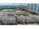 An aerial view of luxury condominiums with a glimpse of city skyline, lake and surrounding landscape at 501 Knights Run Ave # 1209, Tampa, FL 33602