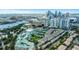 Gorgeous aerial view of luxury townhomes showcasing the community, tennis courts, and city skyline at 501 Knights Run Ave # 1209, Tampa, FL 33602