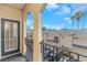 Balcony overlooking community with view of palm trees and tile roofs at 501 Knights Run Ave # 1209, Tampa, FL 33602