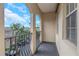 Balcony with black iron railing overlooking the community and landscaping at 501 Knights Run Ave # 1209, Tampa, FL 33602