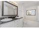 Bright bathroom with double vanity and soaking tub at 501 Knights Run Ave # 1209, Tampa, FL 33602