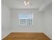Well-lit bedroom with hardwood floors and ceiling fan at 501 Knights Run Ave # 1209, Tampa, FL 33602