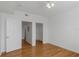 Bedroom with hardwood floors, walk in closet, and attached bathroom at 501 Knights Run Ave # 1209, Tampa, FL 33602