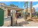 Community car wash area with vacuum and trash bin, surrounded by palm trees and lush greenery for a private wash at 501 Knights Run Ave # 1209, Tampa, FL 33602