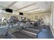 Cardio and weight machines on a blue carpet, perfect for getting in a full workout and staying active in a resort setting at 501 Knights Run Ave # 1209, Tampa, FL 33602