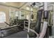Gym featuring mirrors, weights, and weight machines to provide a full body workout for residents and guests at 501 Knights Run Ave # 1209, Tampa, FL 33602