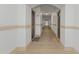 Hallway with dark entry doors and decorative floor design at 501 Knights Run Ave # 1209, Tampa, FL 33602