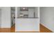 Well-lit kitchen with breakfast bar overlooking the living area, featuring stainless steel appliances at 501 Knights Run Ave # 1209, Tampa, FL 33602