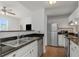 Well-lit open kitchen featuring stainless steel appliances and a breakfast bar at 501 Knights Run Ave # 1209, Tampa, FL 33602