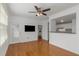 Bright living room with open access to kitchen, and wood floors at 501 Knights Run Ave # 1209, Tampa, FL 33602