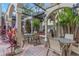 Outdoor kitchen with grills, seating, and a pergola at 501 Knights Run Ave # 1209, Tampa, FL 33602
