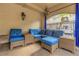 Outdoor patio with blue seating area and wicker furniture at 501 Knights Run Ave # 1209, Tampa, FL 33602