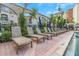 Inviting poolside area with lounge chairs and lush landscaping at 501 Knights Run Ave # 1209, Tampa, FL 33602