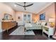 Comfortable peach bedroom with a wood frame bed, modern furniture, and plenty of natural light at 5141 Riva Ridge Dr, Wesley Chapel, FL 33544