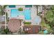 A top-down aerial shot shows a community pool, clubhouse, playground, and spa at 5141 Riva Ridge Dr, Wesley Chapel, FL 33544