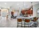 Open concept kitchen with stainless steel appliances, island, and breakfast bar at 5141 Riva Ridge Dr, Wesley Chapel, FL 33544