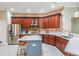 Open kitchen with stainless steel appliances, modern counters and center island at 5141 Riva Ridge Dr, Wesley Chapel, FL 33544