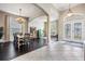 Bright living room with hardwood floors and French door entry with decorative glass at 5141 Riva Ridge Dr, Wesley Chapel, FL 33544