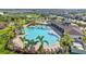 An aerial view of a community pool and seating area at 5170 Sea Mist Ln, Wesley Chapel, FL 33545