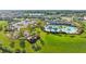 An aerial view of a community with a pool, playground, and parking at 5170 Sea Mist Ln, Wesley Chapel, FL 33545