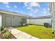 Private backyard with a well-maintained lawn and white fence at 5170 Sea Mist Ln, Wesley Chapel, FL 33545