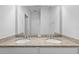 Bathroom featuring double sinks with granite counters and a large mirror at 5170 Sea Mist Ln, Wesley Chapel, FL 33545
