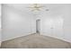 Neutral bedroom featuring a ceiling fan and spacious closet for ample storage space at 5170 Sea Mist Ln, Wesley Chapel, FL 33545