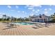 A community pool with lounge chairs and a covered pavilion at 5170 Sea Mist Ln, Wesley Chapel, FL 33545