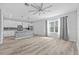 Open living space showcasing hardwood floors, contemporary decor, and natural light at 5170 Sea Mist Ln, Wesley Chapel, FL 33545