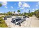 Outdoor picnic area featuring stone pavers, multiple picnic tables, and a grill for residents' enjoyment at 5170 Sea Mist Ln, Wesley Chapel, FL 33545