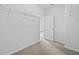 Walk-in closet with wire shelving and neutral carpet at 5170 Sea Mist Ln, Wesley Chapel, FL 33545