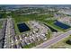 Aerial view of a new community featuring lake views and manicured landscaping at 5470 Flint Hills Dr, Wimauma, FL 33598