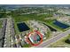 Aerial view of a community with serene ponds and lush green spaces, offering a peaceful living environment at 5470 Flint Hills Dr, Wimauma, FL 33598