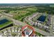 Aerial view of a community surrounded by serene ponds and lush green spaces, offering a peaceful living environment at 5470 Flint Hills Dr, Wimauma, FL 33598