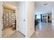 Bathroom with a shower/tub combination and tile flooring, accessible from an adjacent room at 5470 Flint Hills Dr, Wimauma, FL 33598