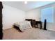 Bedroom with carpet, window with blinds, desk and chair at 5470 Flint Hills Dr, Wimauma, FL 33598
