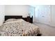 Bedroom with carpet, window with blinds, desk and chair, and closet with double doors at 5470 Flint Hills Dr, Wimauma, FL 33598
