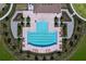 Overhead shot of a community pool, showing chaise lounges and manicured landscaping around the pool area at 5470 Flint Hills Dr, Wimauma, FL 33598