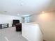 Cozy upstairs living room featuring neutral carpet and a comfortable leather sectional at 5470 Flint Hills Dr, Wimauma, FL 33598