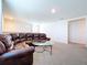 Upstairs living area with plush leather seating, perfect for entertaining and enjoying downtime at 5470 Flint Hills Dr, Wimauma, FL 33598
