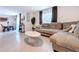 Comfortable living room adjacent to a dining area, featuring tile floors and ample space at 5470 Flint Hills Dr, Wimauma, FL 33598