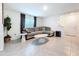 Living room featuring neutral colors, tile flooring and stylish furniture at 5470 Flint Hills Dr, Wimauma, FL 33598