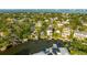 Expansive aerial view reveals the neighborhood, waterfront homes, and canal leading out to the bay at 593 Marmora Ave, Tampa, FL 33606