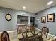 Bright dining area featuring a glass top table, seating for four, and a pass-through kitchen at 750 Island Way # 101, Clearwater Beach, FL 33767