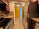 Kitchen with stainless steel refrigerator and appliances and views of the living space at 750 Island Way # 101, Clearwater Beach, FL 33767